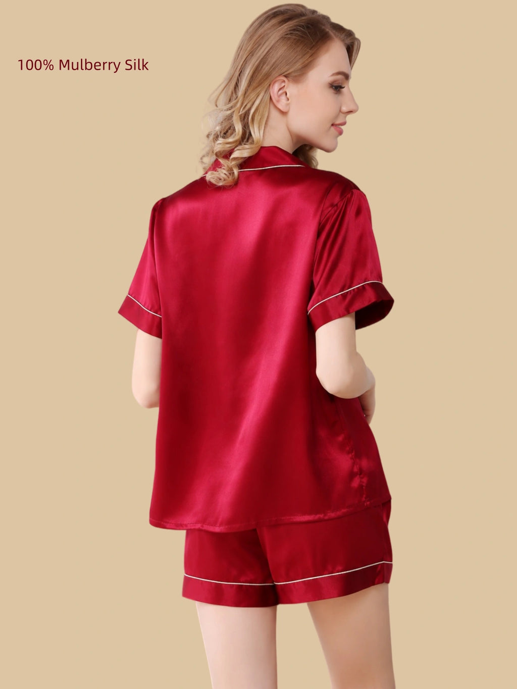 Back three-quarter view of a Deep Navy silk shirt and shorts pajama set