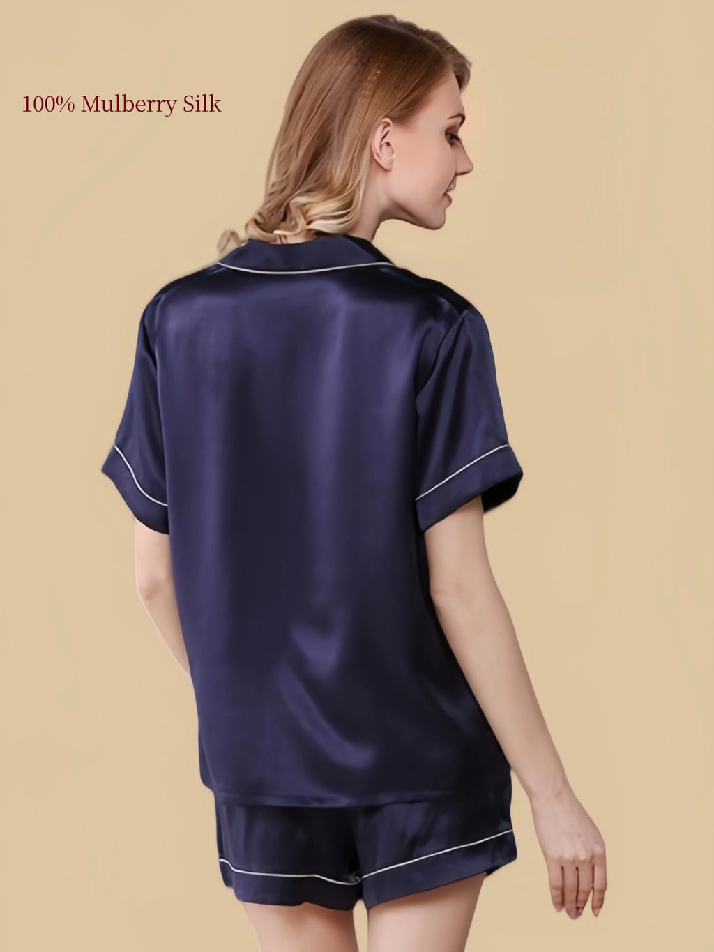 Back three-quarter view of a Deep Navy silk shirt and shorts pajama set