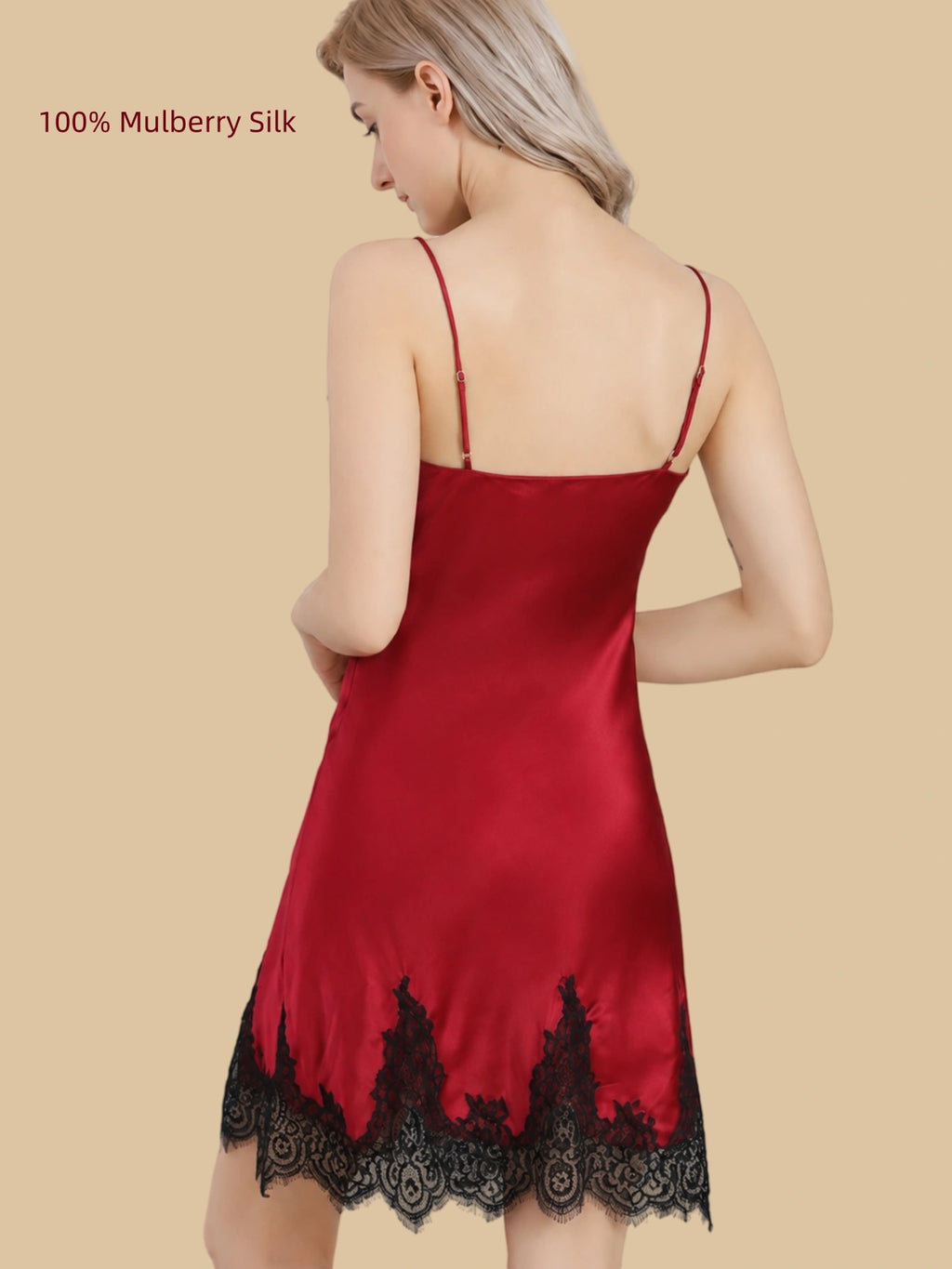 Back view of a Deep Red 16 Momme mulberry silk slip dress with adjustable straps and black lace hem