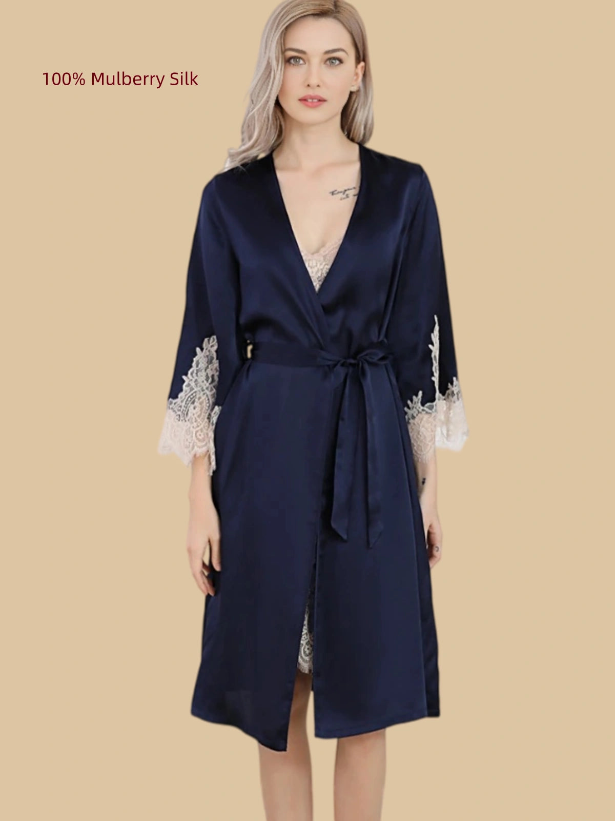 Front view of a Navy Blue 16 Momme mulberry silk wrap robe with ivory lace cuffs and a tie waist
