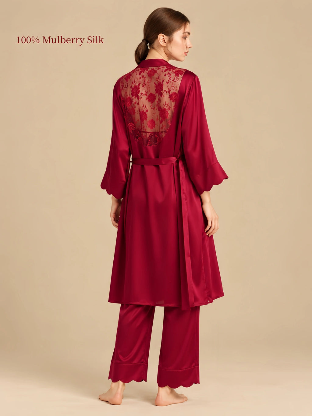 Rear view of Luxurious Red silk robe featuring a floral lace back panel, adjustable waist tie and scalloped sleeves.