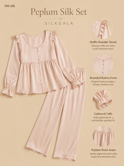 Silkgala 16.5mm peplum silk pajama set flat lay in pink with ruffle shoulder detail, rounded button-front top, gathered cuffs, peplum waist seam, and full-length pants on beige background.