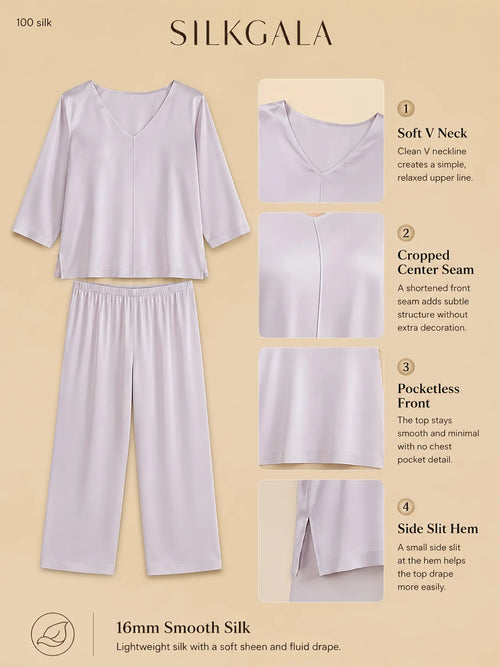 Silkgala 16mm 3/4 sleeve silk pajama set flat lay in soft purple with soft V neckline, pocketless front, cropped center seam, side slit hem, and relaxed straight-leg pants on beige background.