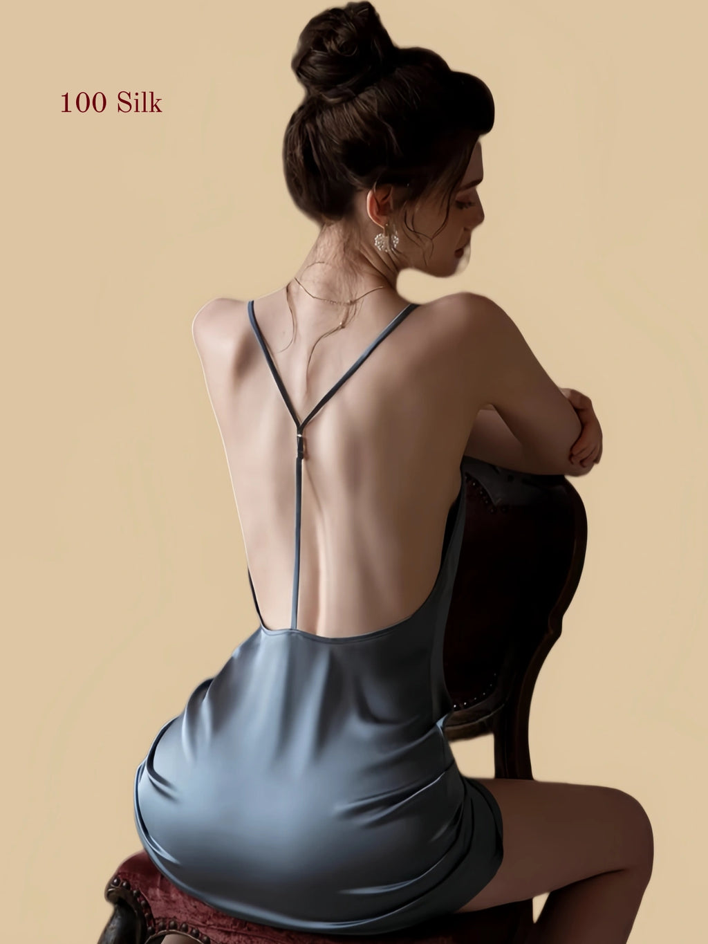 Blue silk nightgown seated back view