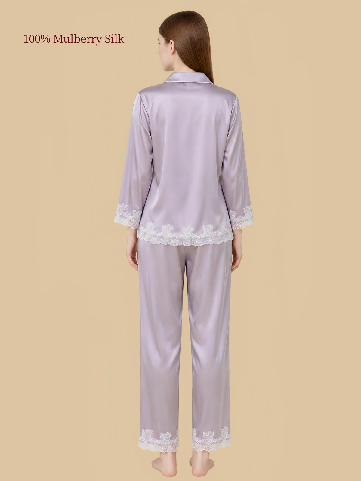 Back view of Silkgala Dusty Lavender silk pajamas showing floral lace along the shirt hem, sleeve cuffs and nine-tenths-length pant hems.