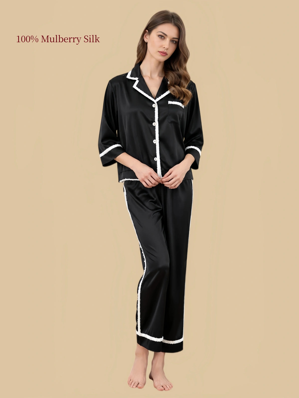 Front view of Black 19 momme mulberry silk pajamas with white braided trim, notched collar and button-front top.