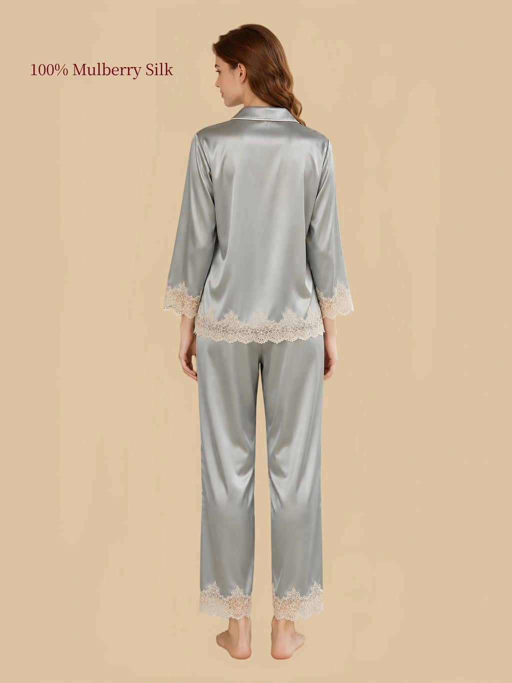 Back view of Silkgala Green mulberry silk lounge set highlighting the smooth silk drape, three-quarter sleeves and floral lace along the cuffs and pant hems