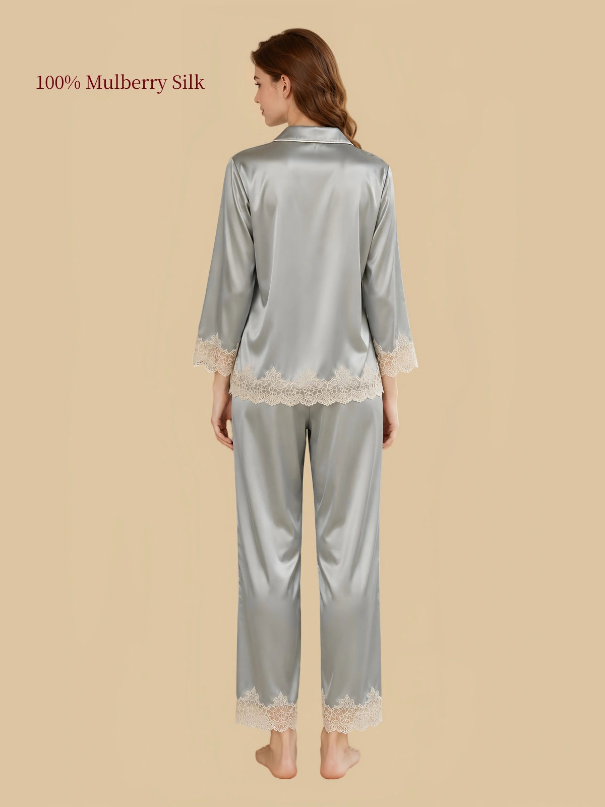 Back view of Silkgala Green mulberry silk lounge set highlighting the smooth silk drape, three-quarter sleeves and floral lace along the cuffs and pant hems
