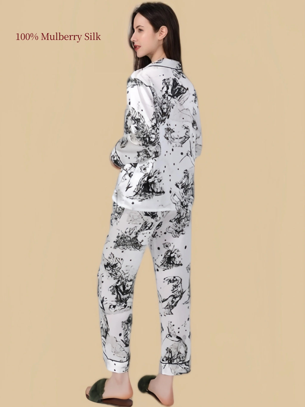 Back view of Silkgala Huase mulberry silk pajama set featuring an abstract black-and-white print across the long-sleeve shirt and pants.