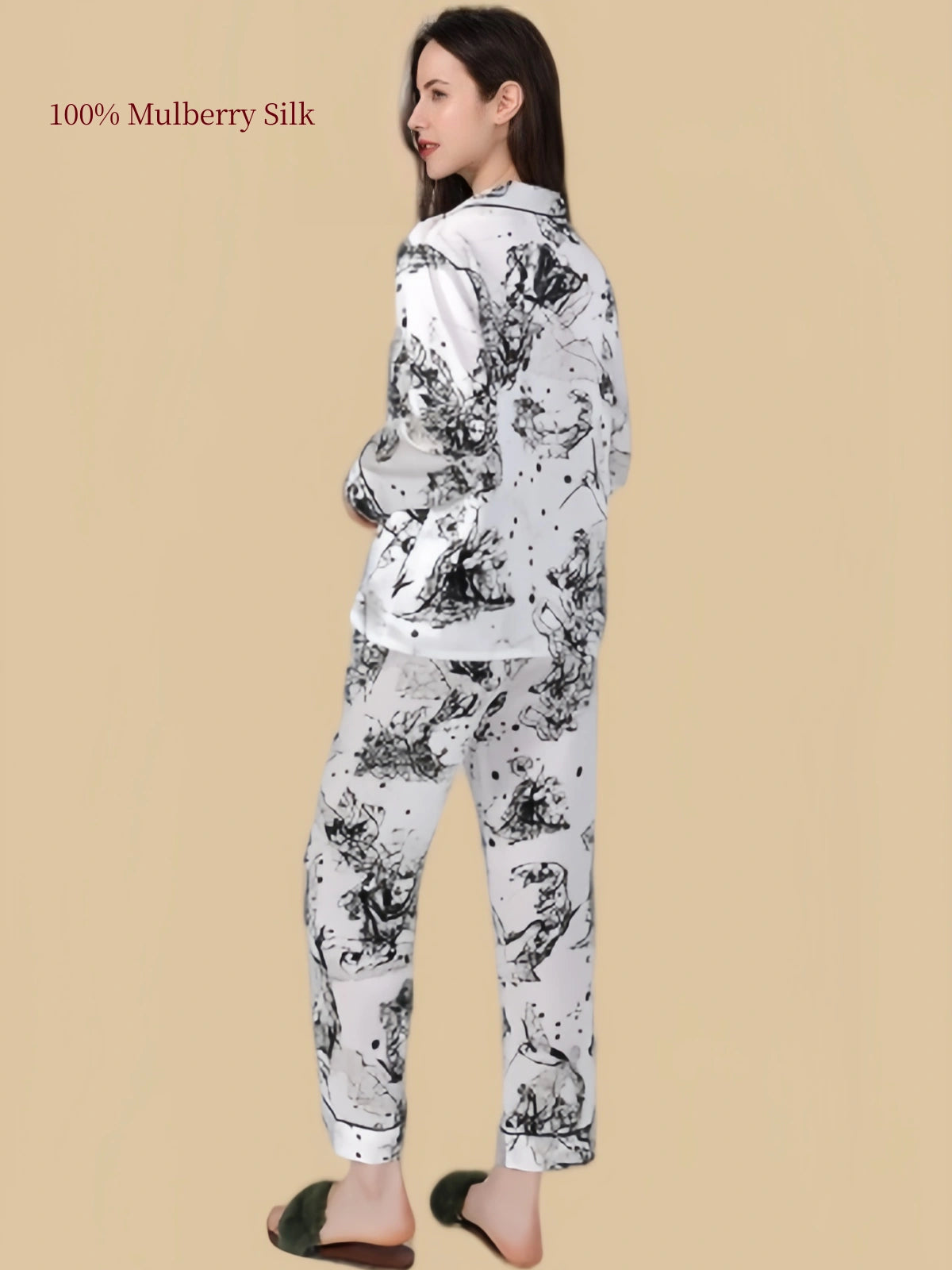 Back view of Silkgala Huase mulberry silk pajama set featuring an abstract black-and-white print across the long-sleeve shirt and pants.