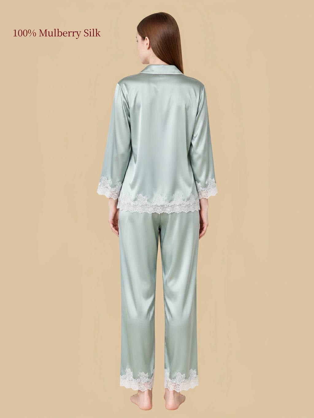 Back view of Silkgala Jade Green mulberry silk pajamas showing the smooth silk drape, floral lace shirt hem and matching pants.