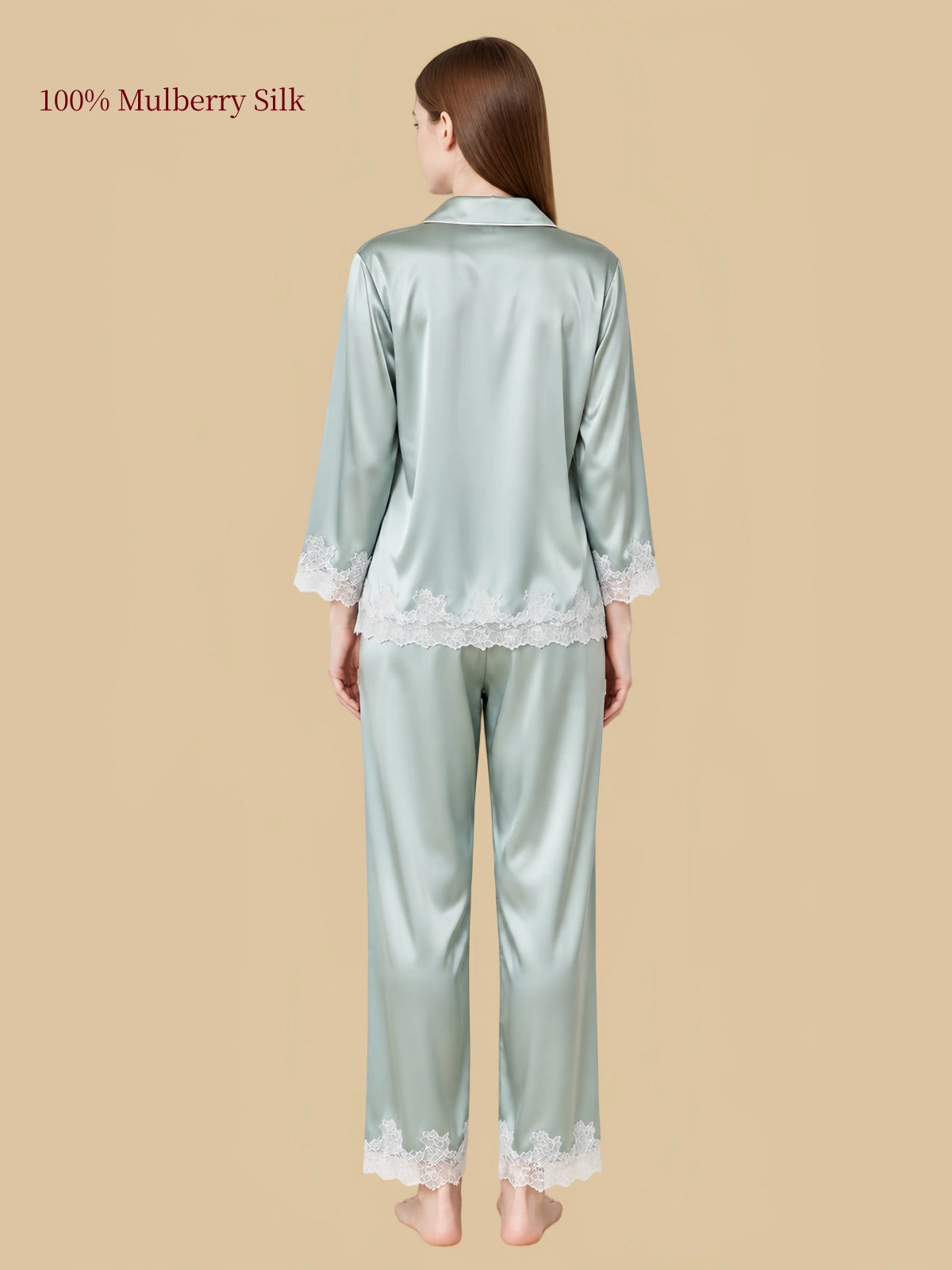 Back view of Silkgala Jade Green mulberry silk pajamas showing the smooth silk drape, floral lace shirt hem and matching pants.