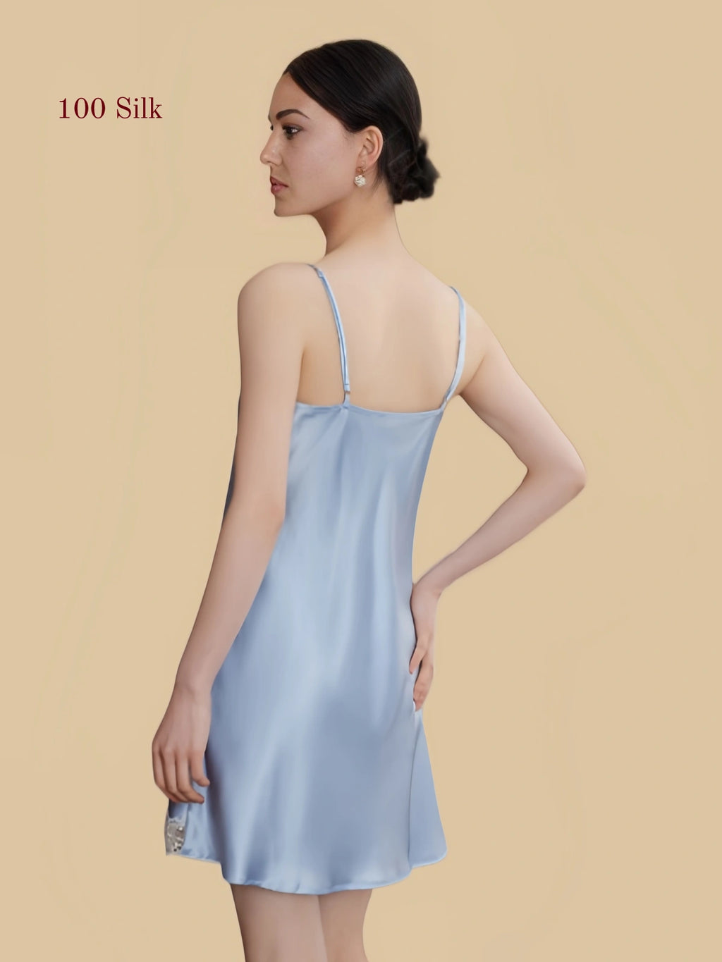 Back view of a light blue 19 Momme mulberry silk chemise with adjustable shoulder straps