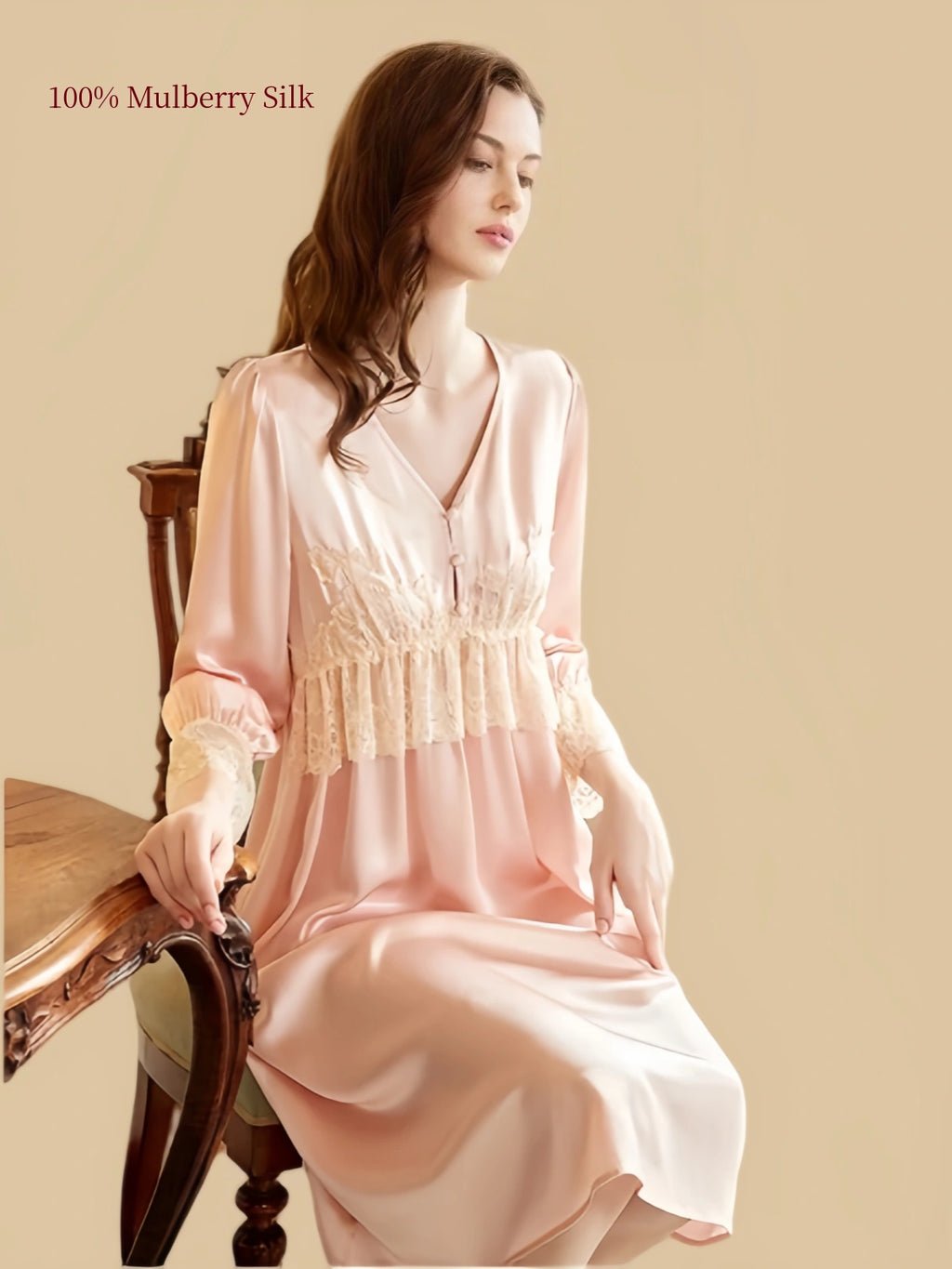 Champagne Pink 19 momme mulberry silk nightgown with V-neck lace trim shown in a seated lifestyle view