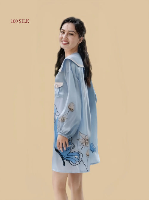 Side view of a Dusty Blue 19 momme mulberry silk sleep dress with long sleeves and butterfly floral placement print
