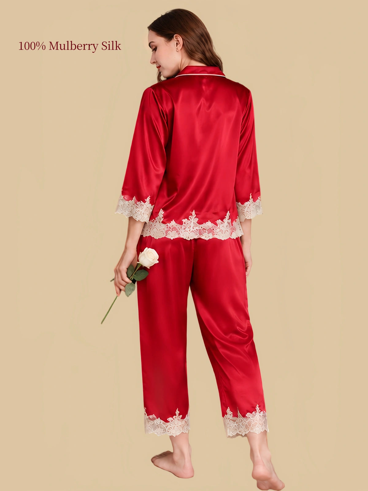 Back view of Rouge Red silk pajamas showing the smooth silk fabric and ivory lace borders on the shirt and cropped pants.