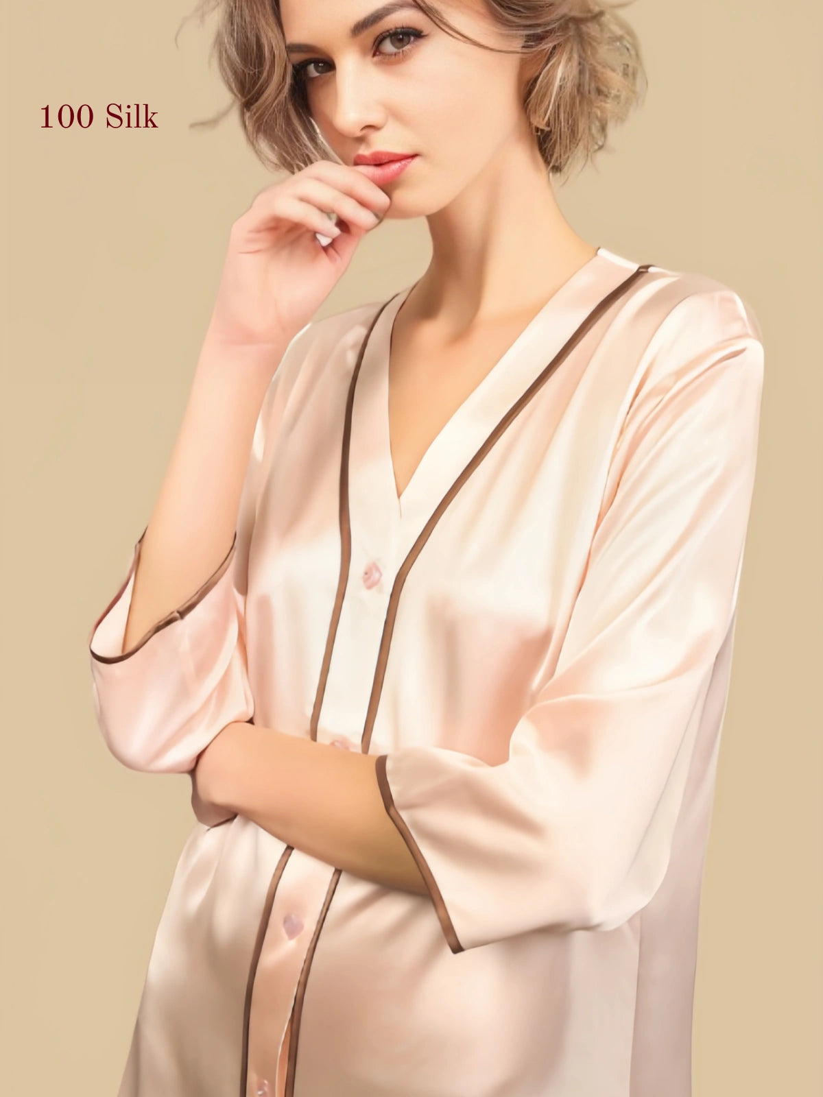 V-neck, button front and contrast piping details on a blush pink silk nightgown