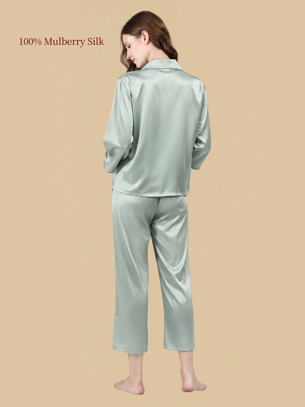 Back view of Pea Green mulberry silk sleepwear showing the relaxed shirt silhouette and straight-leg cropped pants.