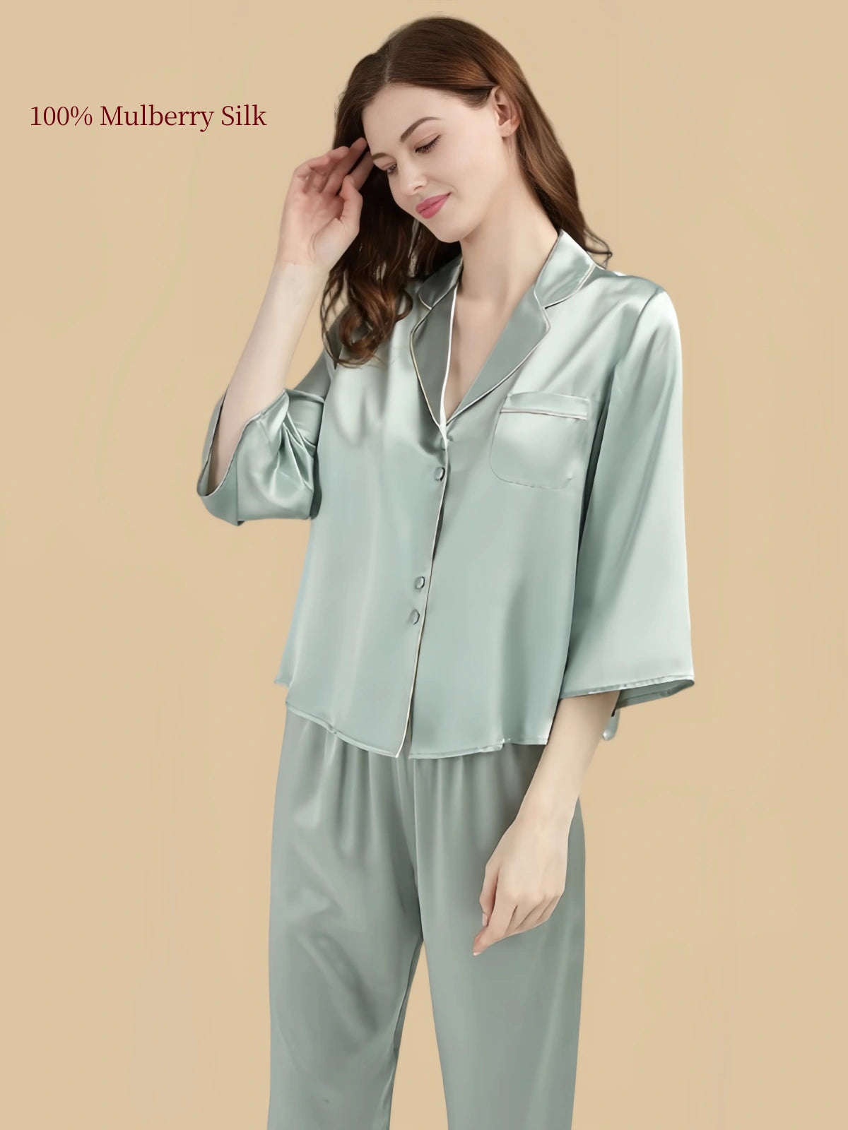 Close-up of Pea Green silk pajama top featuring a notched lapel collar, matching covered buttons and single chest pocket.