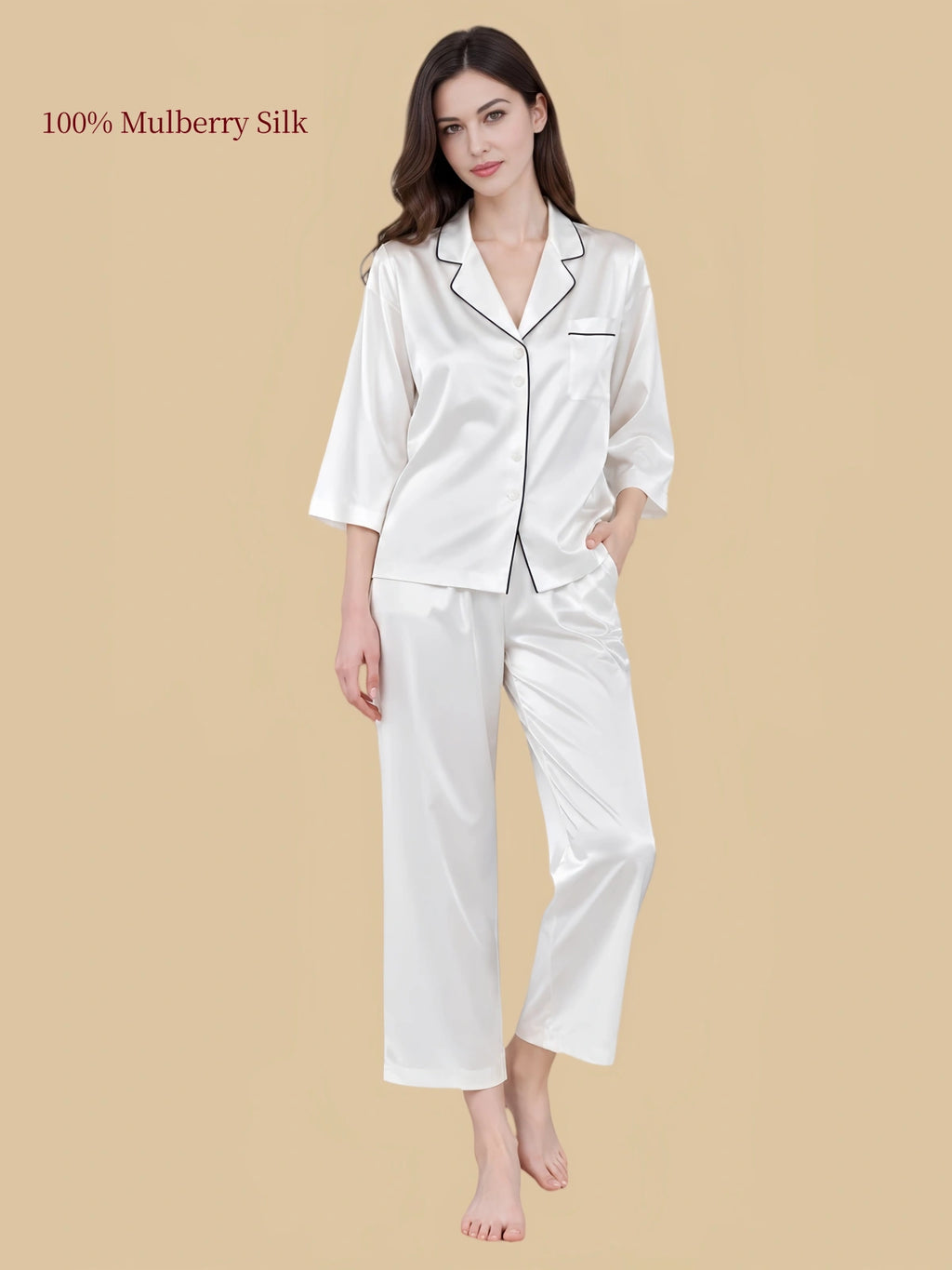 Pearl White silk pajama set with dark contrast piping along the notched collar and chest pocket, paired with cropped pants.