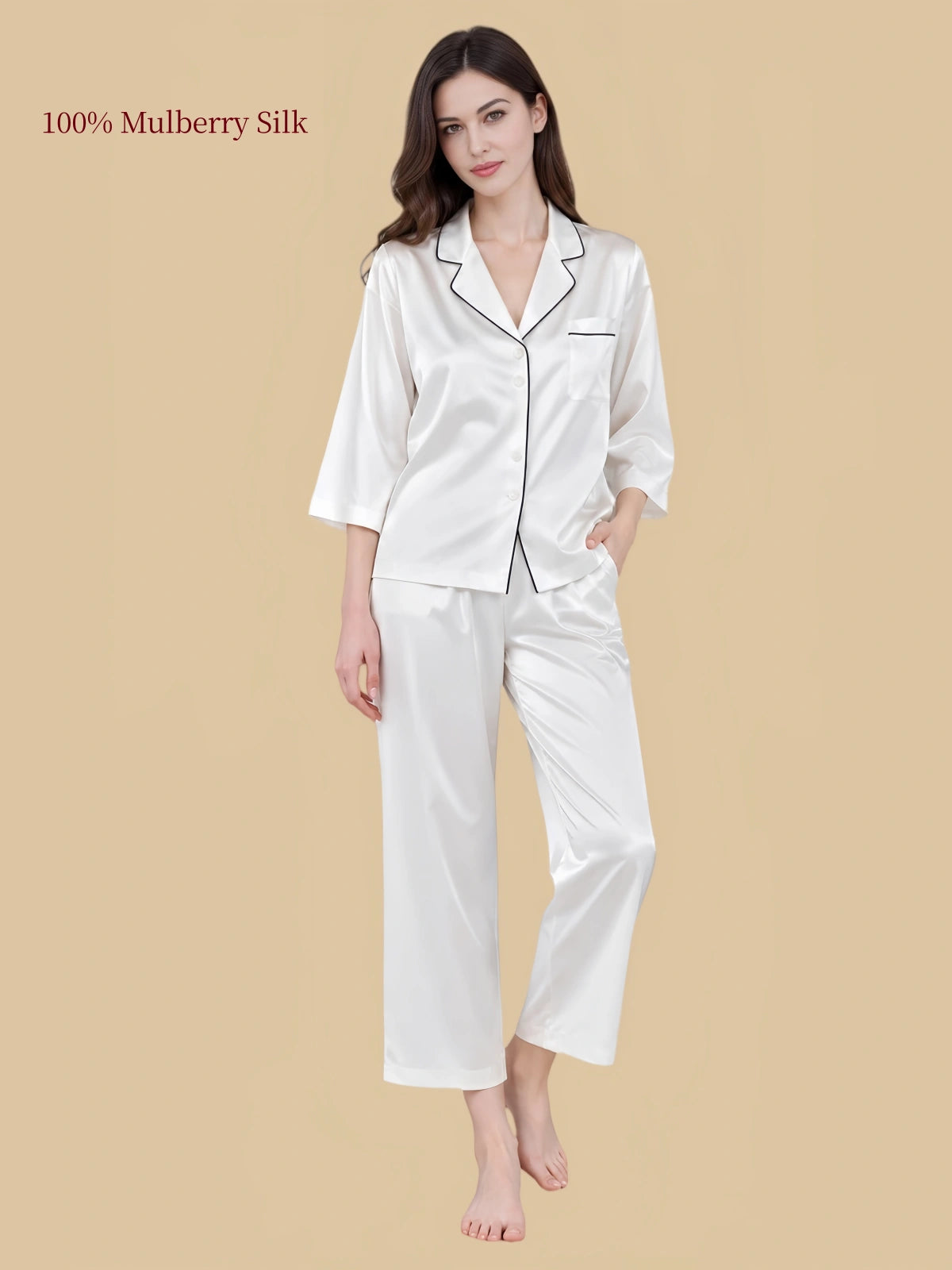 Pearl White silk pajama set with dark contrast piping along the notched collar and chest pocket, paired with cropped pants.