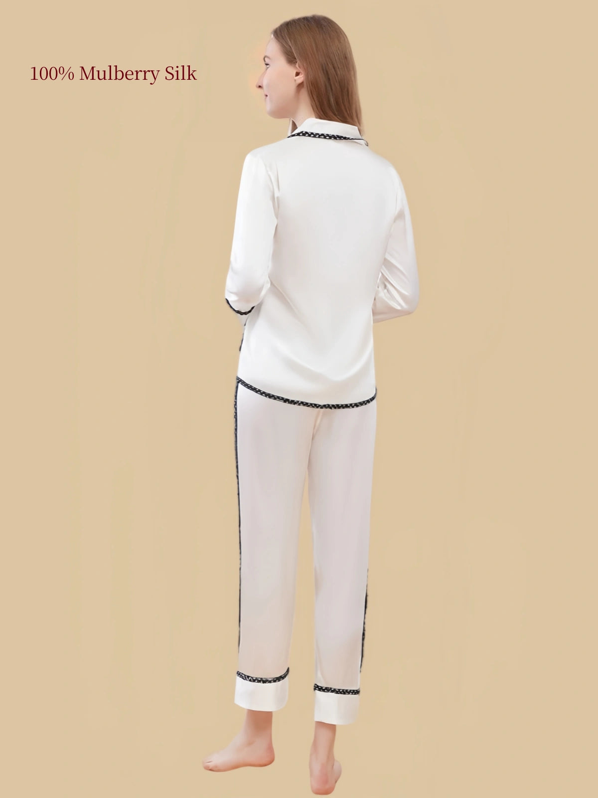 Back view of White long-sleeve silk pajamas showing black braided accents and matching long pants.