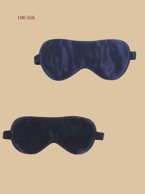 Navy and black 19 momme silk eye masks flat lay with soft elastic side bands