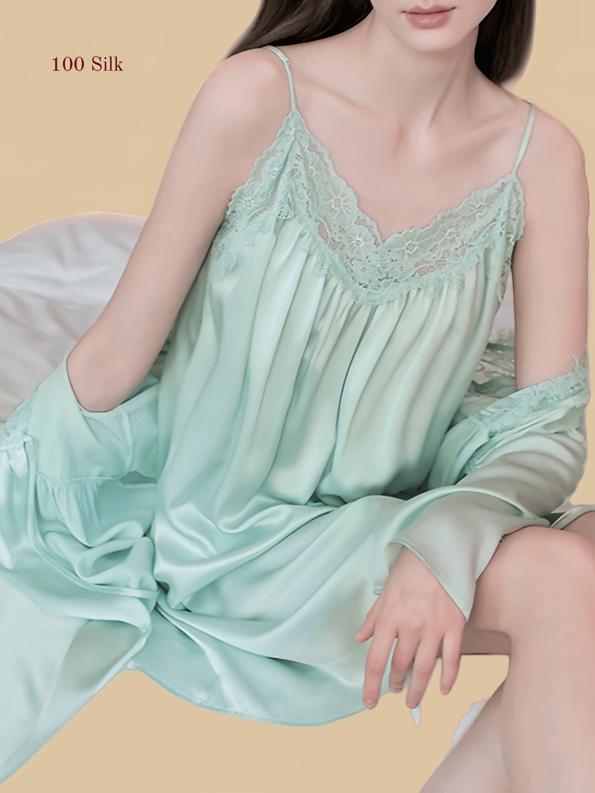 Green 19mm silk slip close view with scalloped lace neckline and draped outer laye