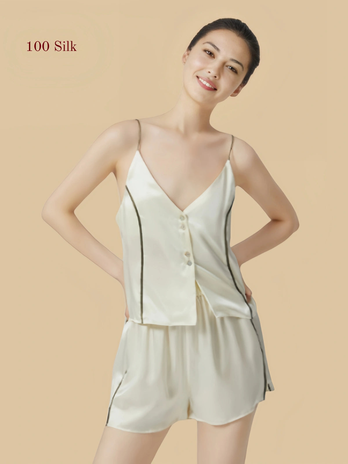 Front view of an ivory 19mm silk short set with a button-front camisole, slim straps and contrast piping.