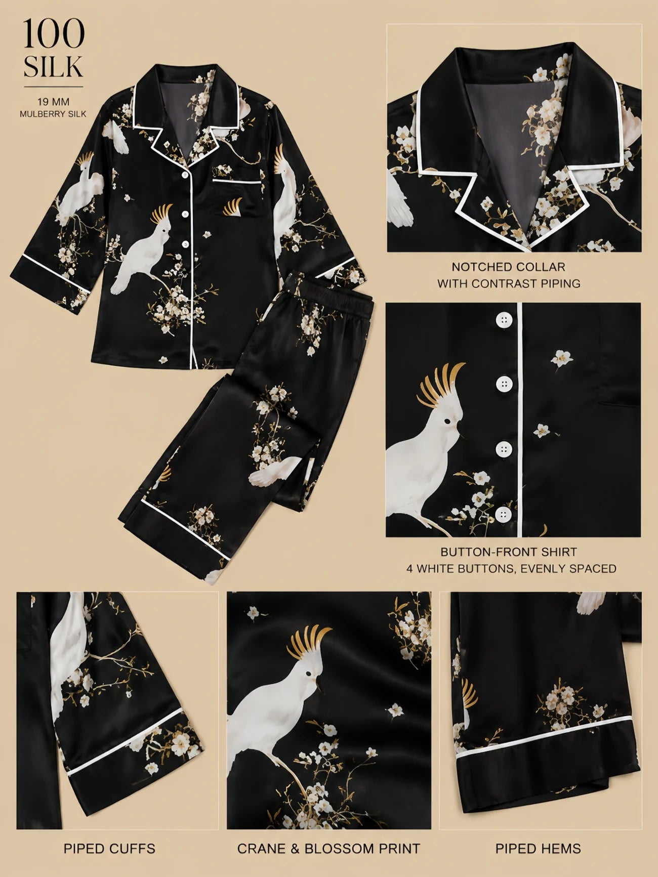 Black 19mm mulberry silk two-piece loungewear set with crane and blossom print, notched collar with contrast piping, four evenly spaced white front buttons, piped cuffs, and full-length straight pants shown in a flat-lay product detail image.