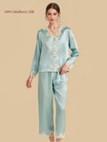 Hazy Blue 22 momme mulberry silk pajama set with floral lace V-neck, decorative button placket and matching lace-trimmed pants.