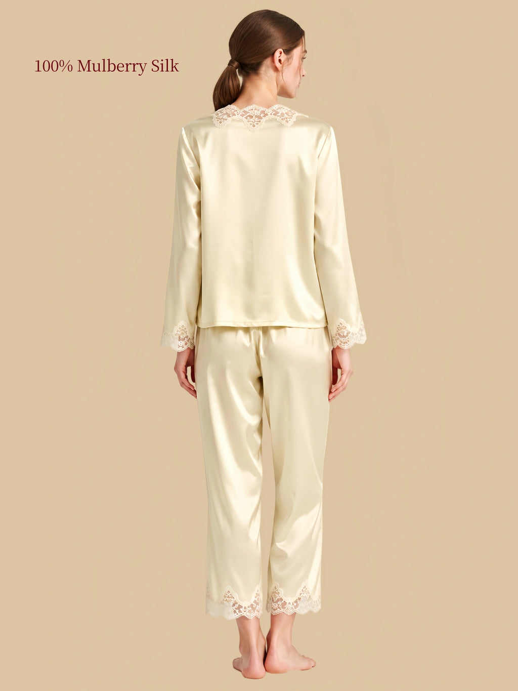 Back view of Coconut Milk silk sleepwear with lace at the upper neckline and scalloped lace trim along the pants.