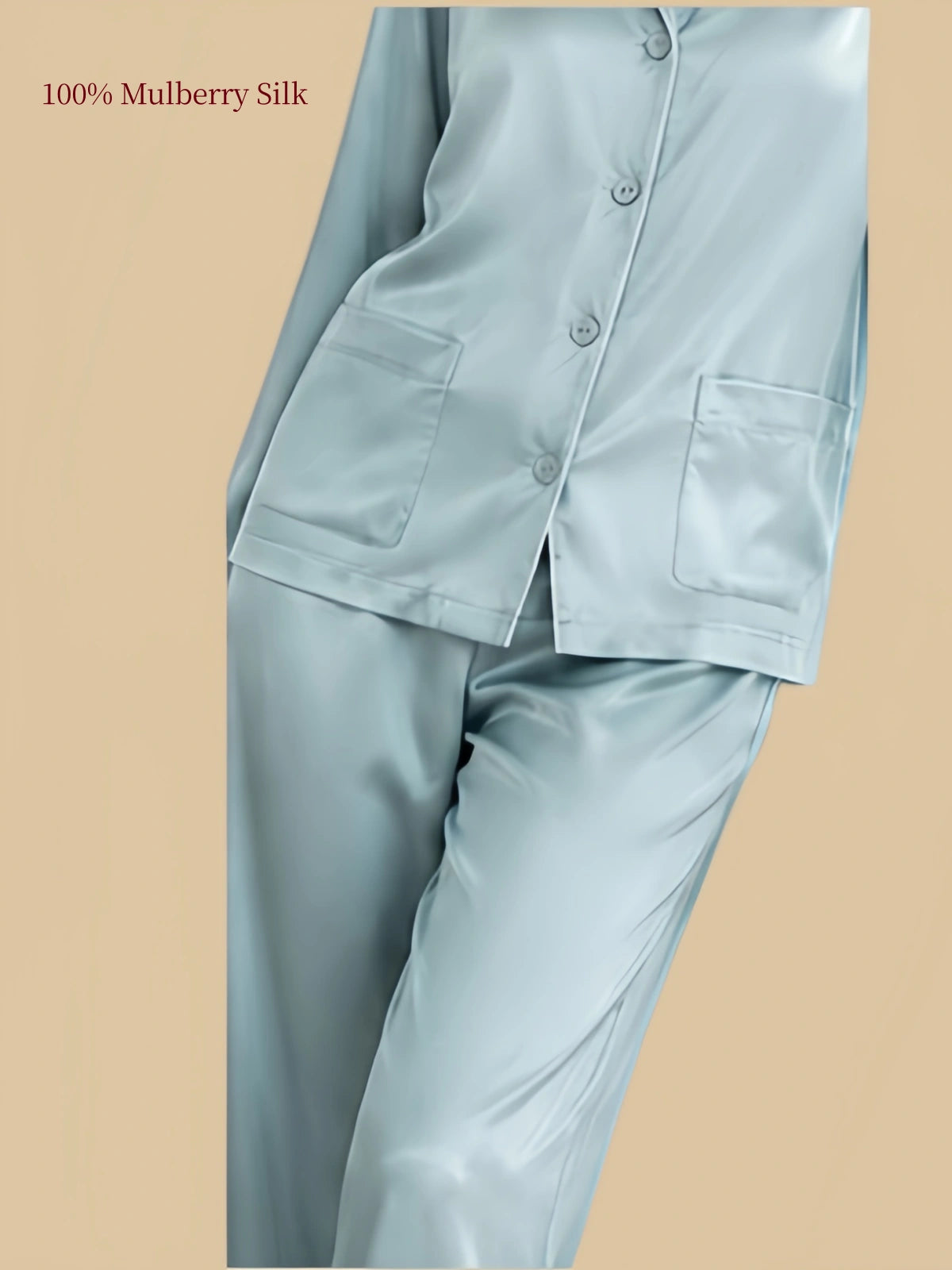 Close-up of Stone Blue silk button-front pajama top showing two practical front patch pockets and matching covered buttons