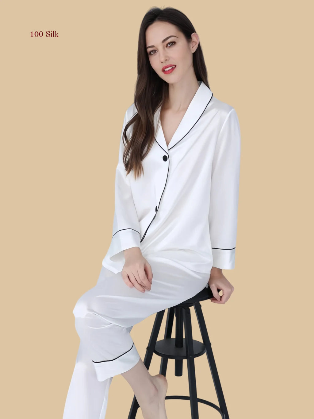 Detail view of black 22mm pajamas showing notched collar, front piping, and pocketless shirt front