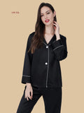 Black 25mm heavyweight pajamas front view with pocketless shirt front, dual contrast buttons, and full-length pants