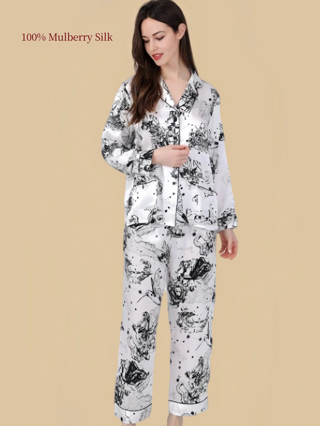 Front view of Silkgala Huase silk pajamas showing two patch pockets, button-front shirt and abstract black ink-inspired pattern.