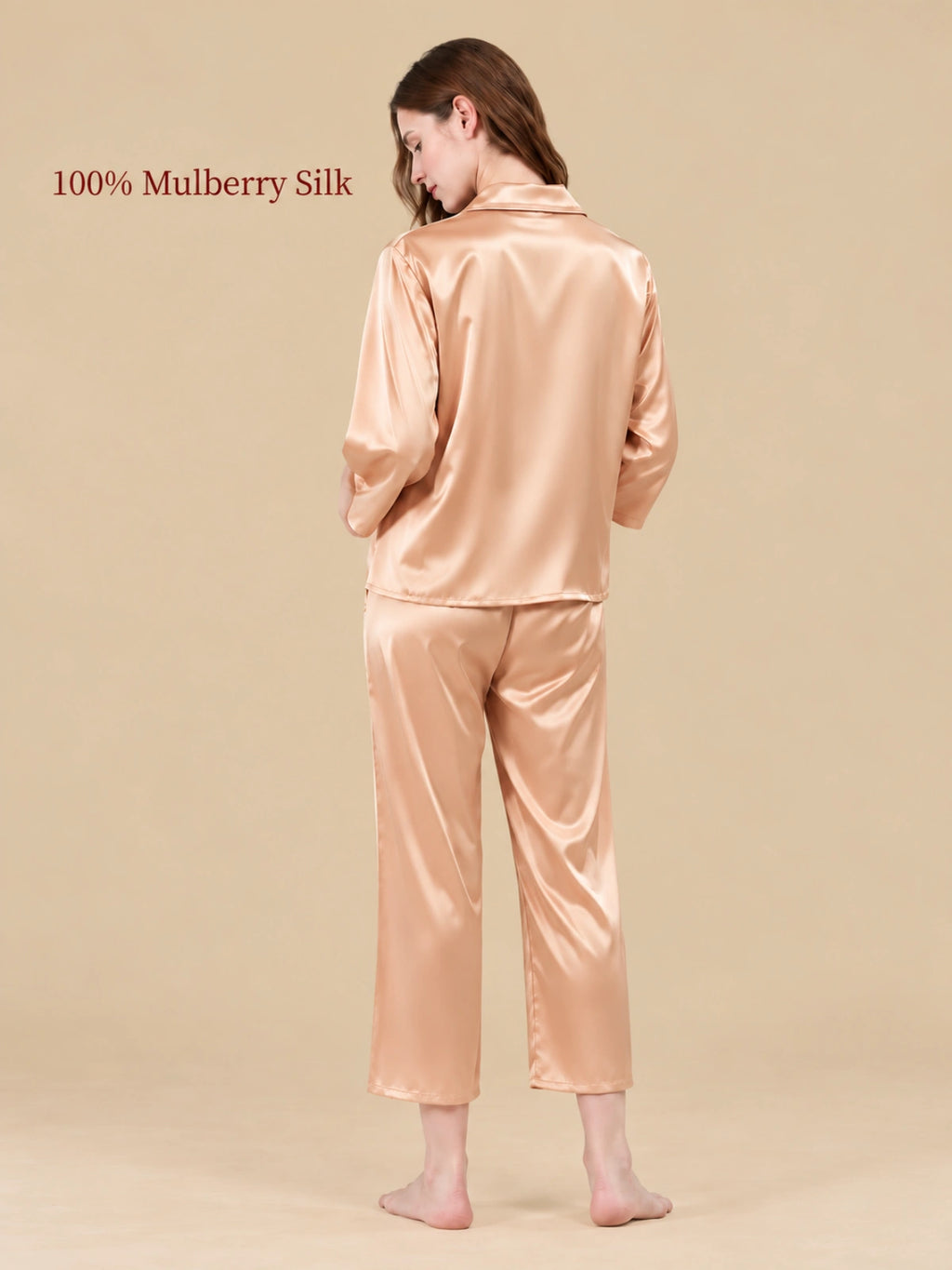 Back view of Wheat Gold silk pajamas highlighting the smooth fabric sheen and relaxed two-piece design.   