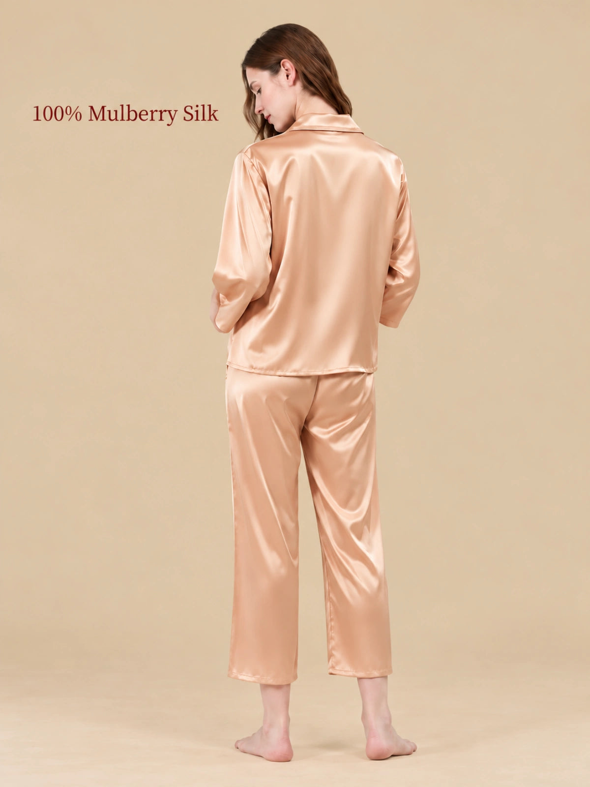 Back view of Wheat Gold silk pajamas highlighting the smooth fabric sheen and relaxed two-piece design.   
