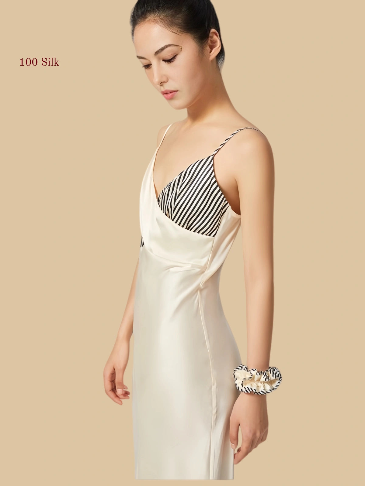 19mm white mulberry silk dress featuring a unique criss-cross wrap bodice with contrasting striped and solid panels.