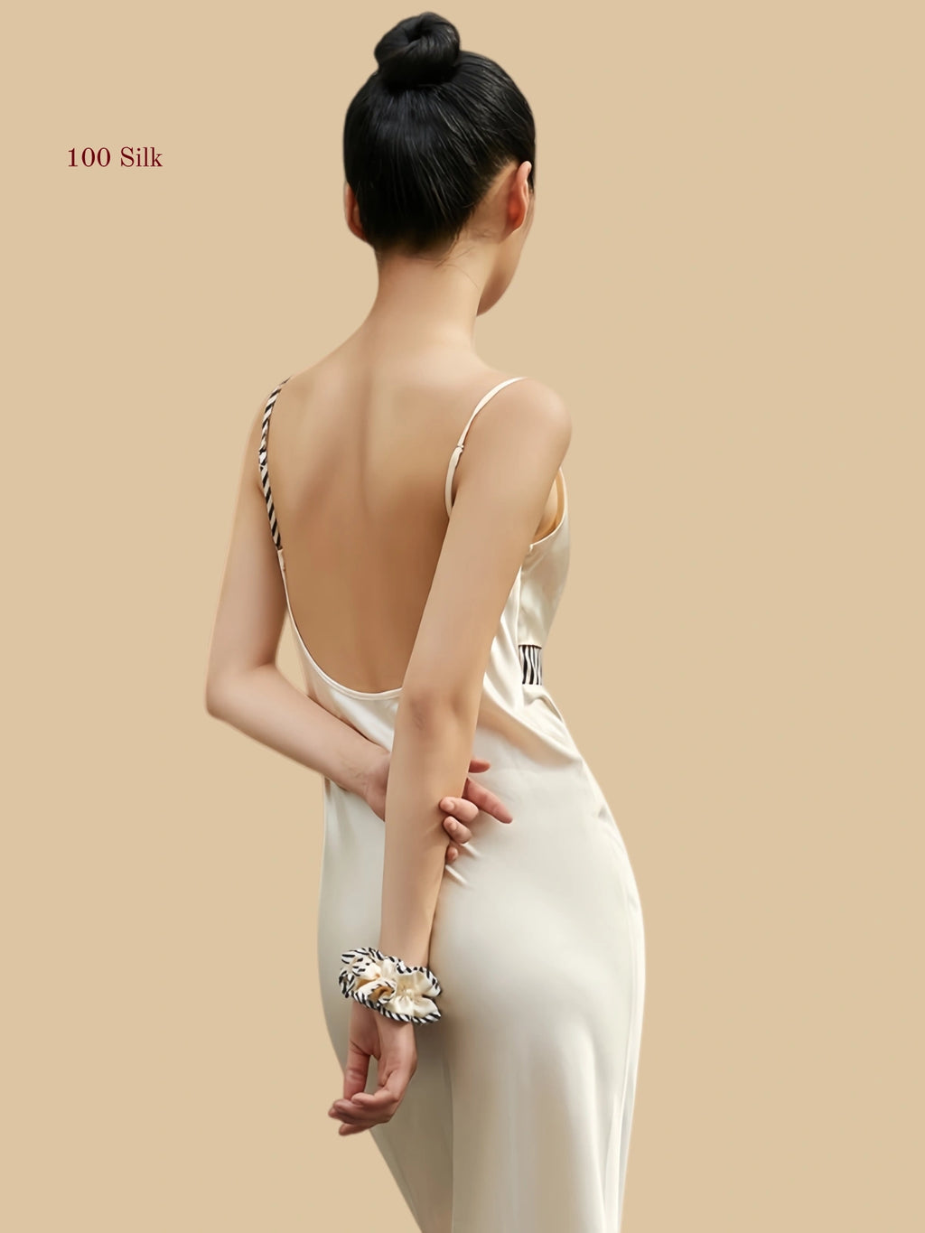 Deep U-shaped open back design with asymmetrical striped straps on a 100% mulberry silk dress.
