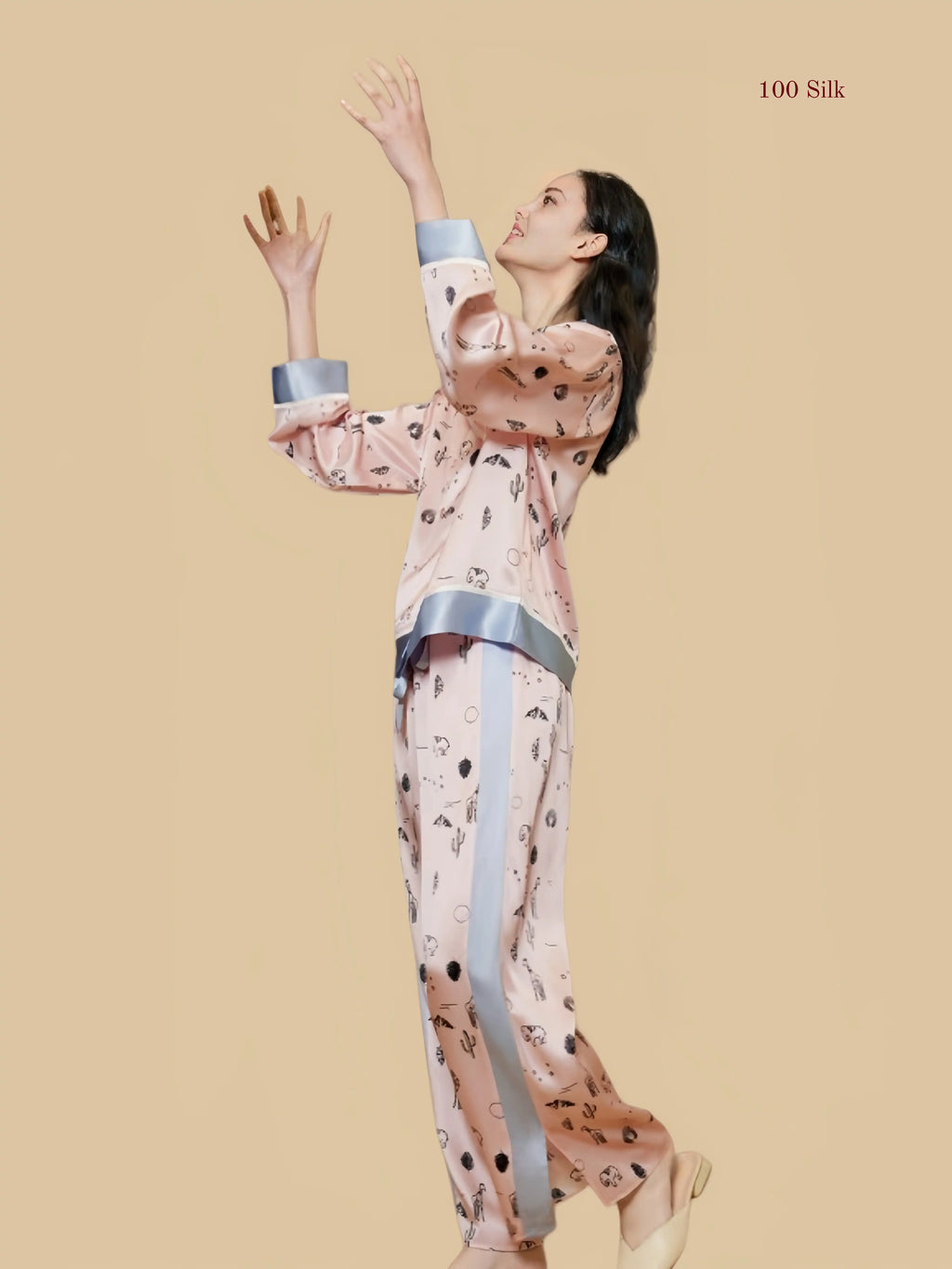 Pink 19mm printed silk set side view with printed long pants and gray cuff detail