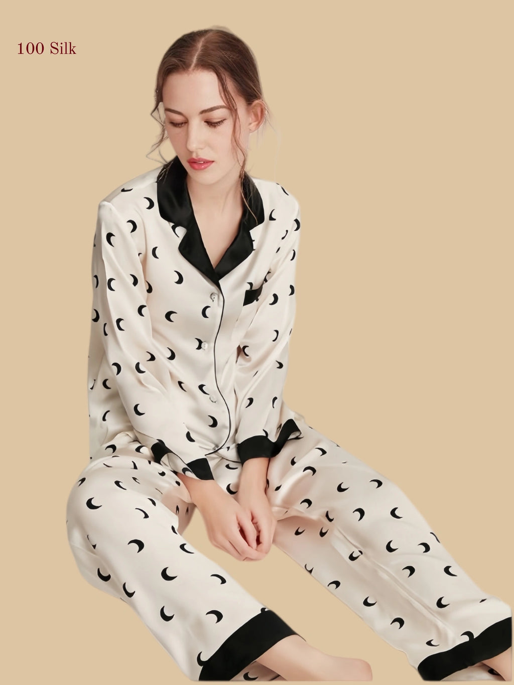 Crescent Ivory 16mm printed silk pajama set seated view with contrast cuffs and moon print