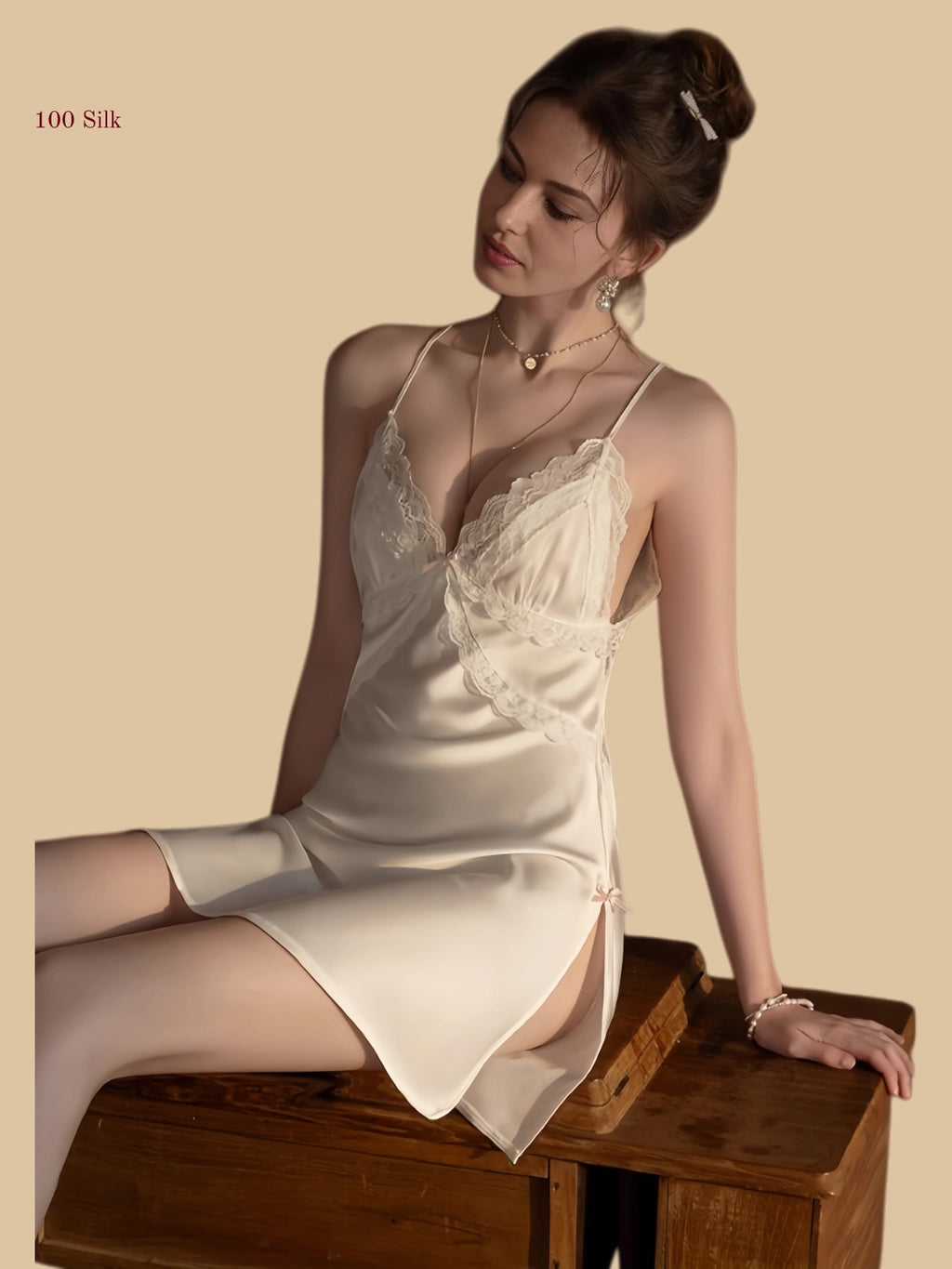 Front view of a 19mm white silk micro dress featuring a unique halter strap and centered bow with a lace-trimmed side slit.