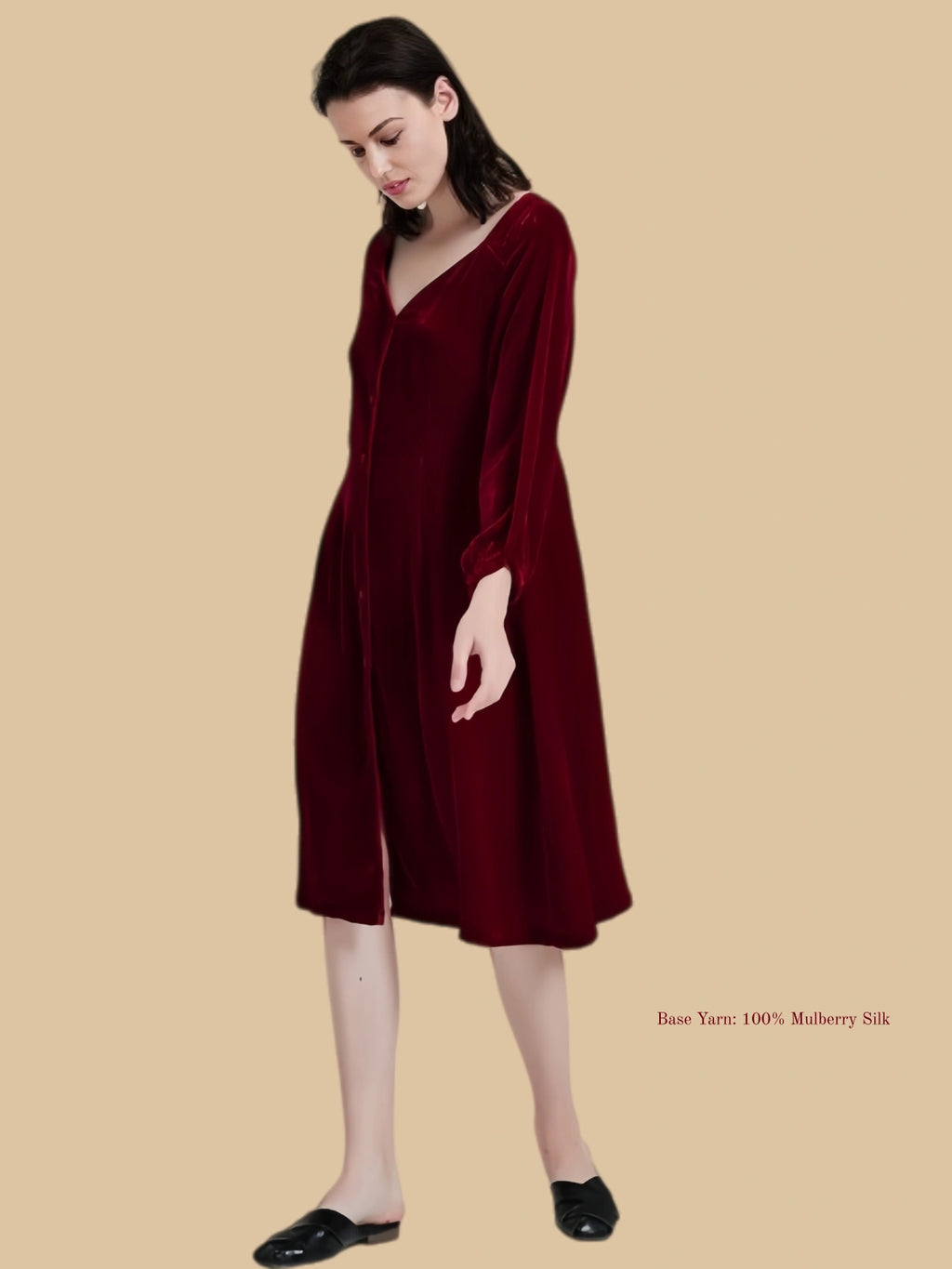 Burgundy velvet dress side-front view with covered button front and long sleeves