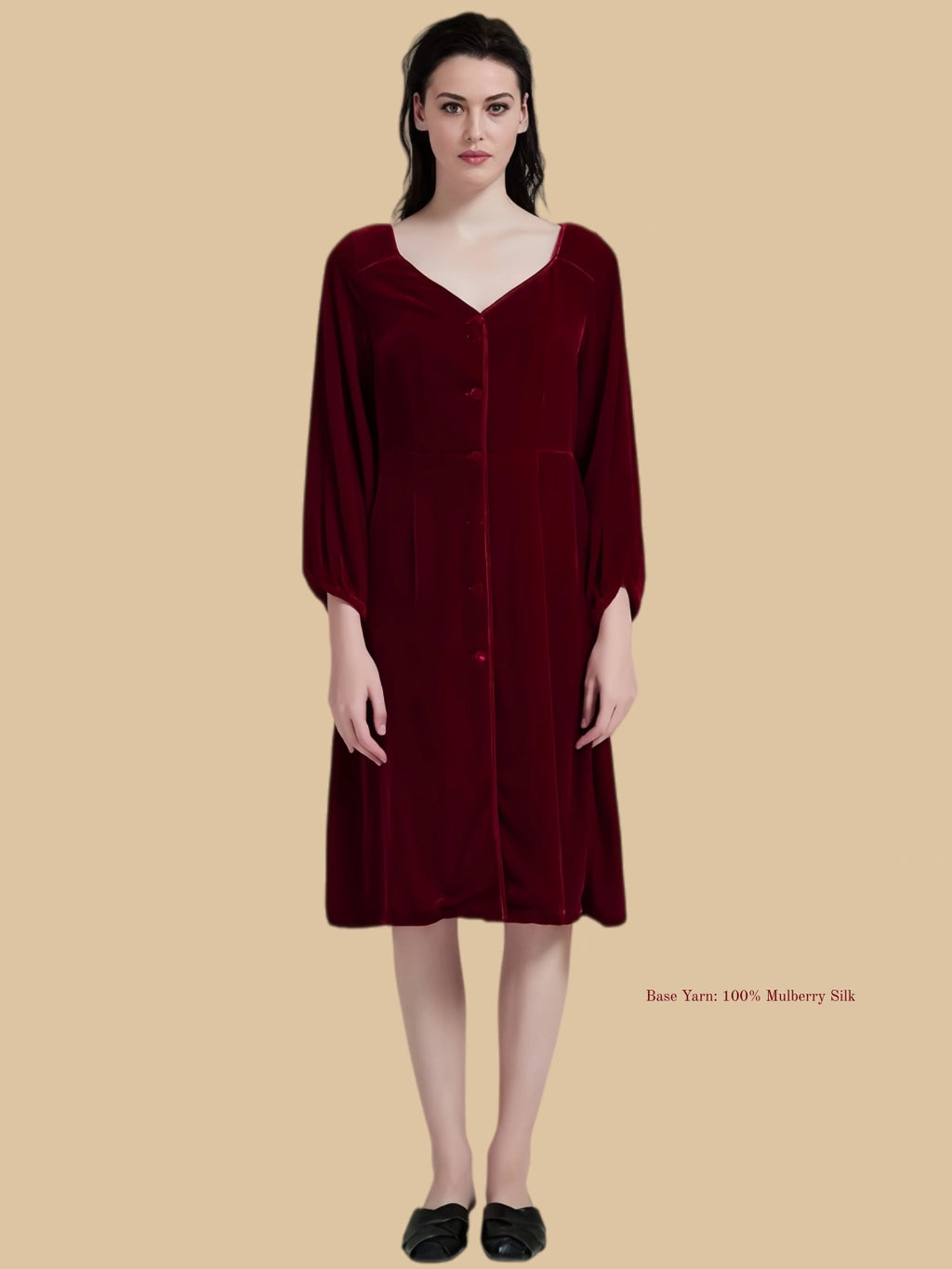 Burgundy velvet dress front view with relaxed V neckline and midi silhouette