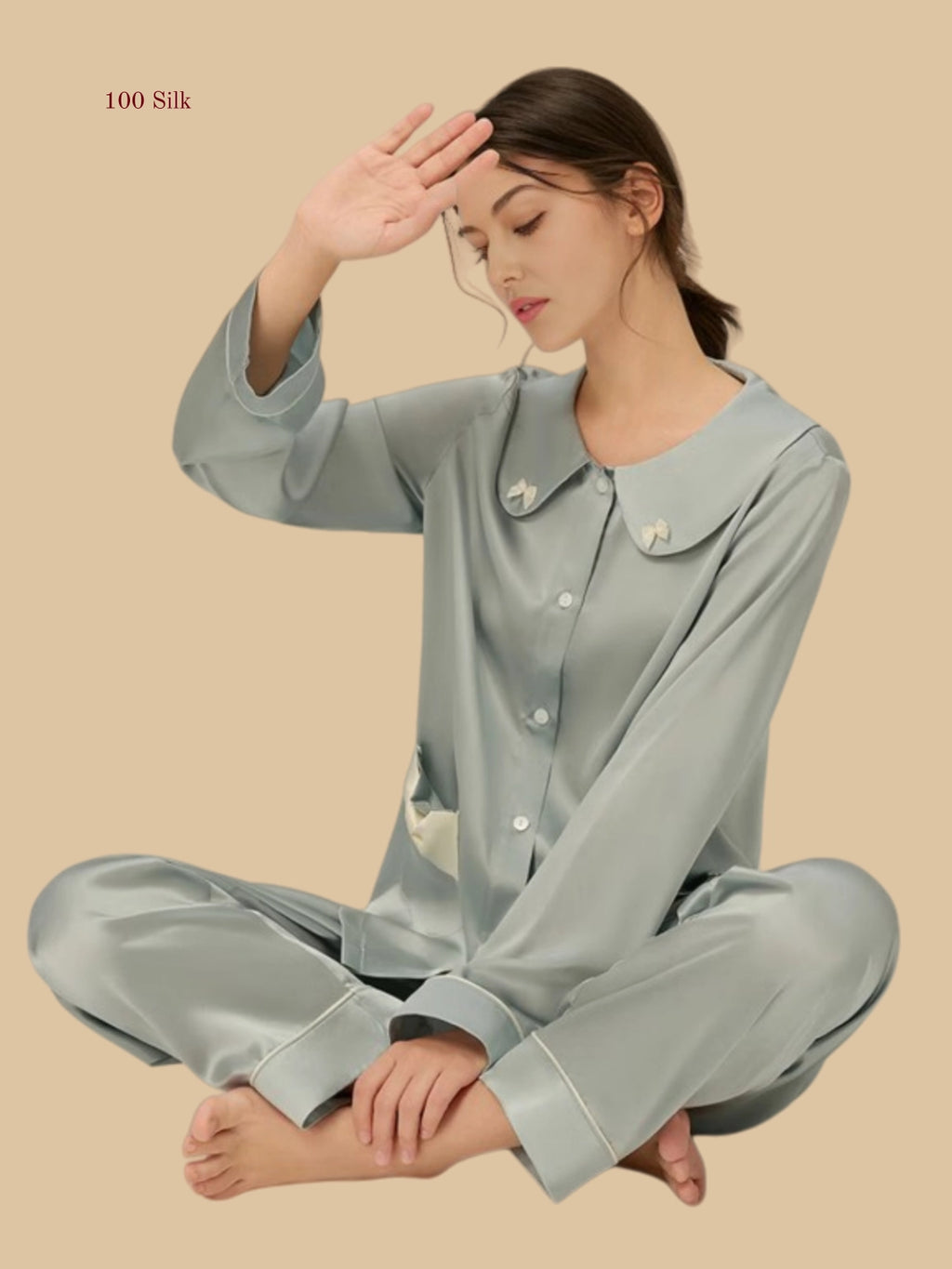 Sky blue 19mm Peter Pan silk set seated view with rounded collar and full-length pants