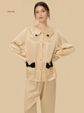 Champagne 19mm Peter Pan silk set front view with oversized collar, bow trims, and full-length pants