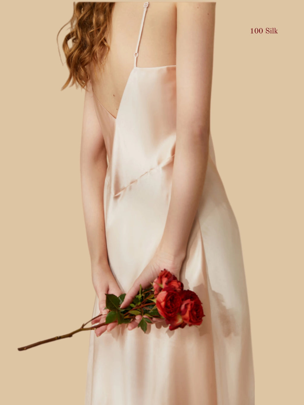 Back view of a champagne silk nightgown showcasing a dramatic backless design and butterfly-contoured bodice.