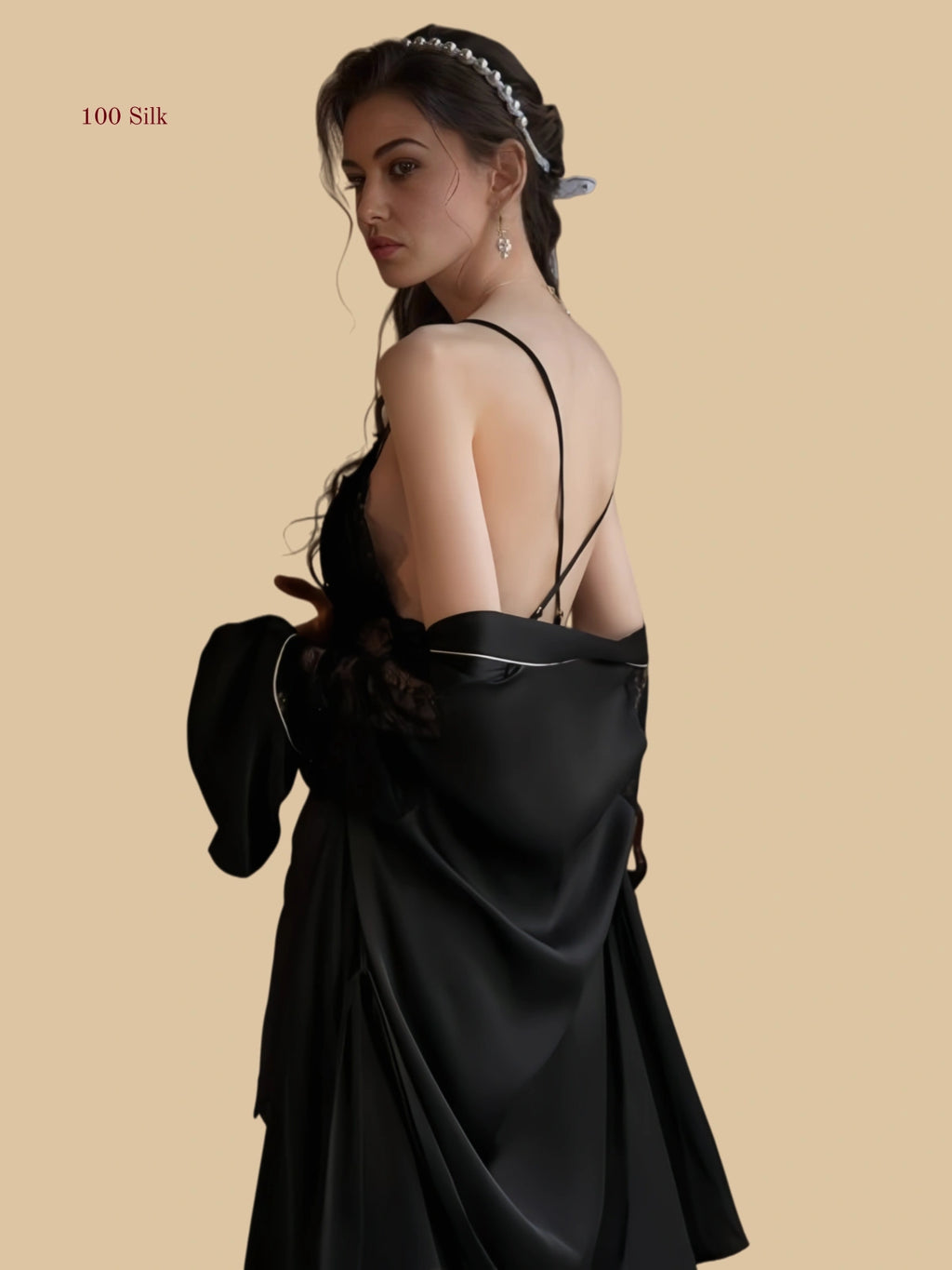 Black 19mm silk slip close-up with deep V lace neckline and center bow