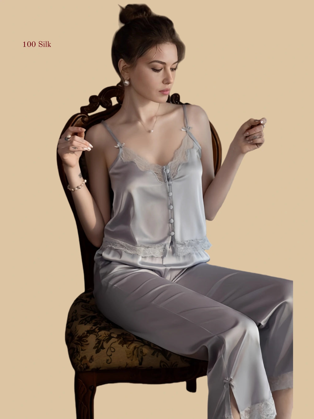 Light purple 19mm silk cami and pants seated view with lace neckline and relaxed straight-leg pants